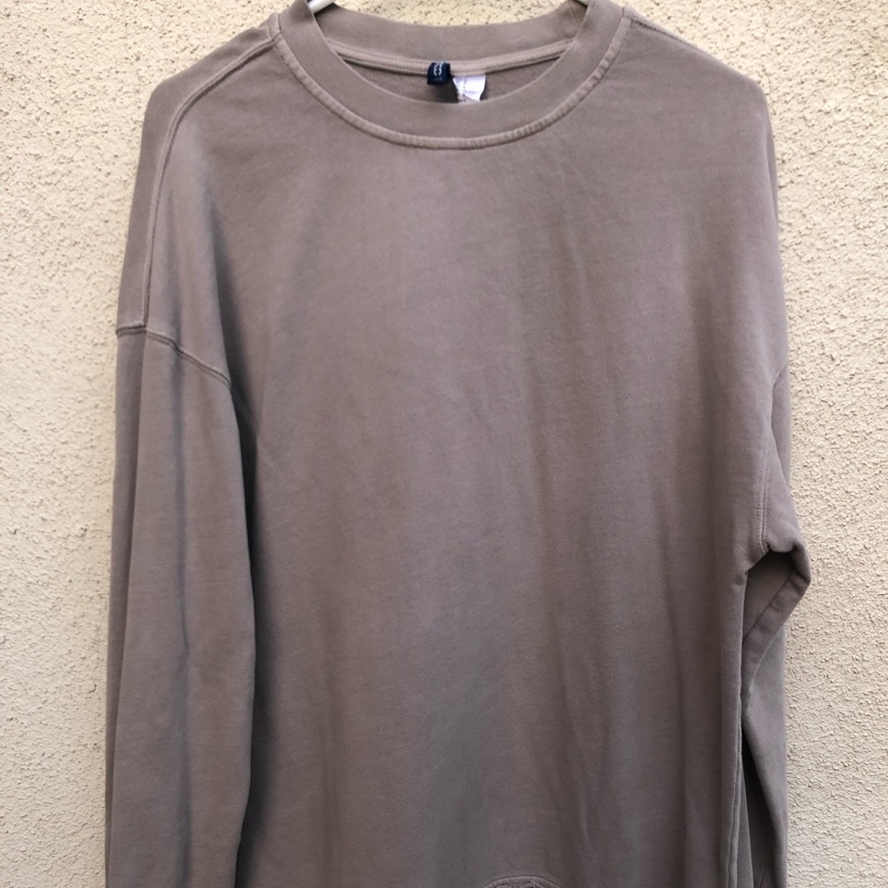 Divided distressed sweater